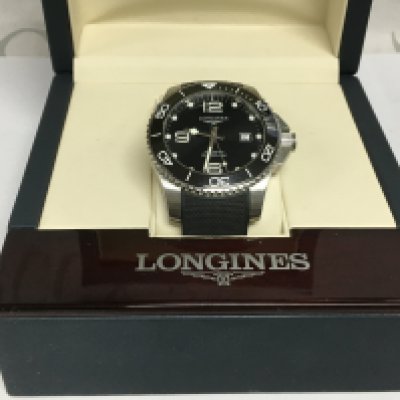 A gents Longines Hydris Conquest automatic watch with box and papers. Shipping category B.