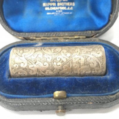 A silver hallmarked perfume case.
