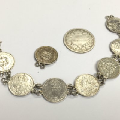 Silver coin bracelet and a Victorian 1875 one shilling. Postage category A