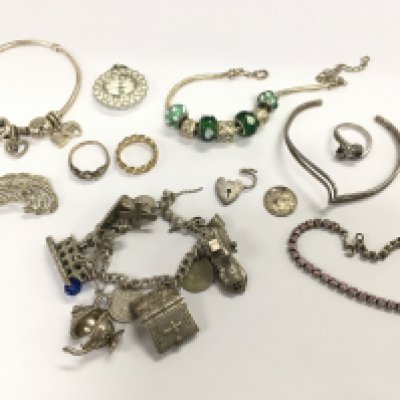 A collection of silver jewellery including bracelets , brooches , rings. Postage category A