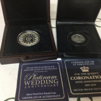A Silver proof five pound coin The Queens platinum wedding anniversary and a silver fifty pence 65th Anniversary (2)