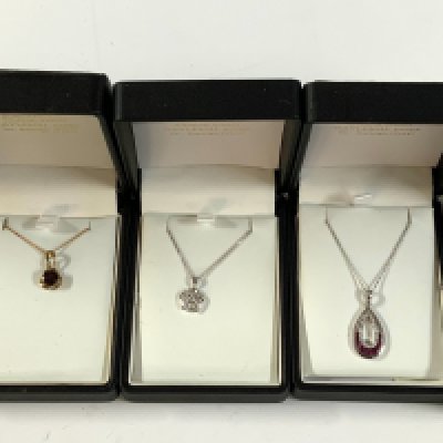 5 9ct gold stone set and pendants and 4 chains. (A)