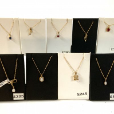 9 good quality 9ct gold and stone set pendants and chains.