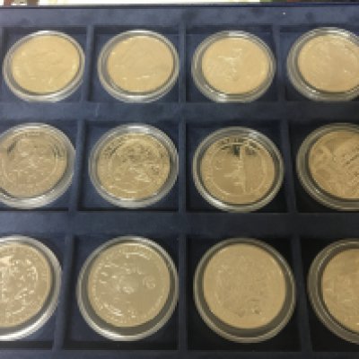 A collection of coins gold plated D-Day coins Sochi Winter Olympic Australian Wildlife coin set and others