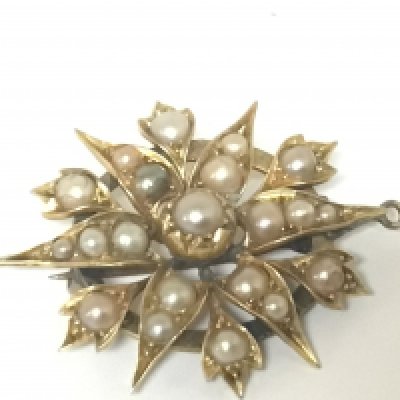 A Pearl set Antique brooch folate star pattern.repaired