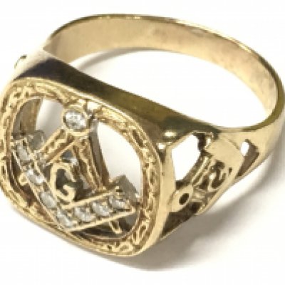 A 9ct gold Masonic ring set with diamonds, approx size Z+2. Approx weight 8.95 grams.