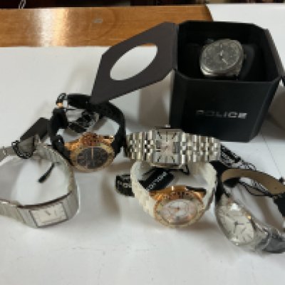 five police watches with tags and one boxed.