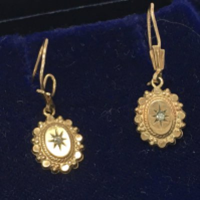 A pair of 9ct gold earrings set with small diamonds , 1.8g total weight. Postage category A