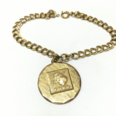 A silver gilt fords long service pendant on a gold plated chain . Postage category A
