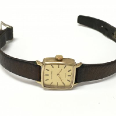 A 9 carat gold cased Garrard watch. Postage category A