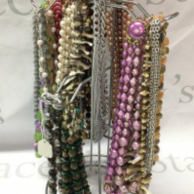 Approximately 15 70s/80s costume jewellery necklaces . Postage category B