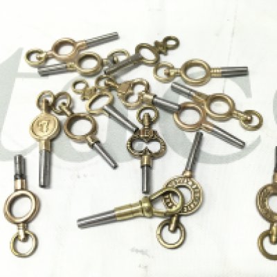 Fifteen vintage pocket watch keys . Postage cat a