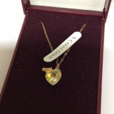A 9carat gold and Crystal necklace in the form of a heart Elizabeth Duke jewellery.