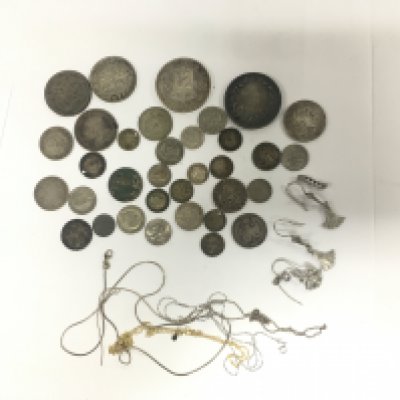 A collection of silver coins and chains, total approx weight 195g. Shipping category A.
