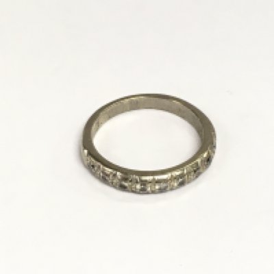 An 18ct white gold half hoop eternity ring, approx 4.9g and approx size P. Shipping category A.
