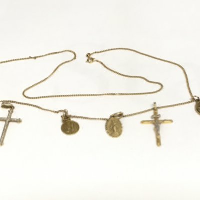 A 9ct gold necklace we attached crosses and religious pendants, approx 10.5g. Shipping category A.