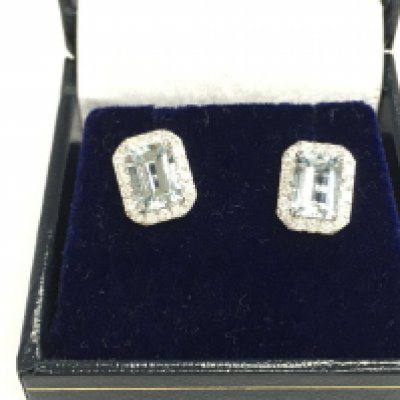 Pair of 18ct white gold emerald cut aquamarine and diamond studs in box. Aquamarine 1.62ct and diamonds 0.40ct.