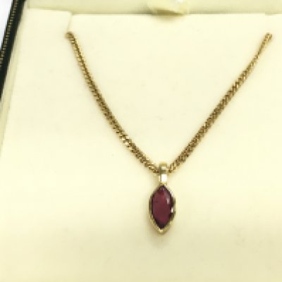 A 9ct gold chain with ruby pendant. 4.82g