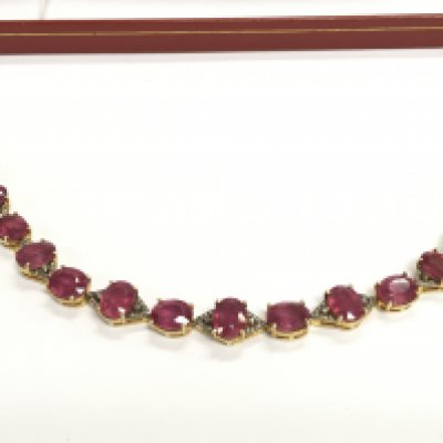 Silver gilt bracelet set with oval rubies (glass filled) and diamonds. Rubies Approx 28ct and 0.70ct diamonds.