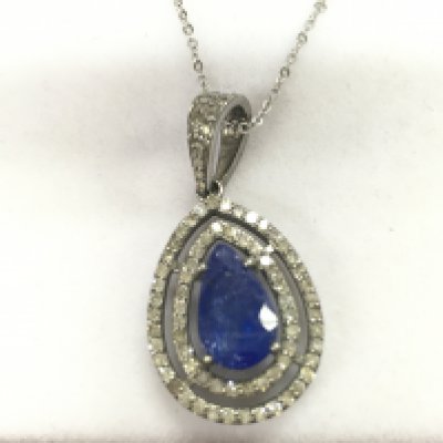 A silver pendant with pear shaped tanzanite surrounded by diamonds on a silver chain. Tanzanite 3.61ct and diamonds 0.71ct approximately.