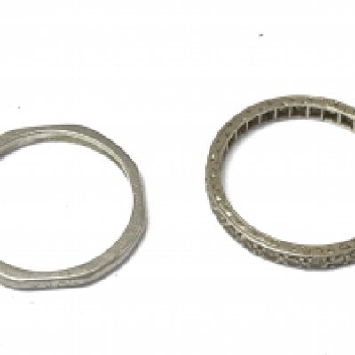 Two platinum bands (one being an eternity ring). Size O & M. 4.9g total weight Postage category A