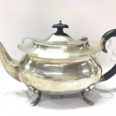 A Rococo flared Teapot . Marked Birmingham 1937 .16.5cm tall. Postage category B