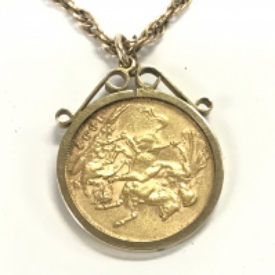 A 1897 sovereign with Melbourne mint mark in 9ct mount and chain. 20.88g Postage B