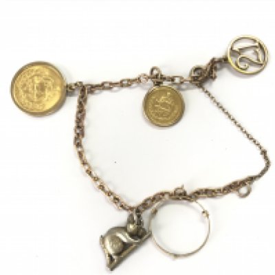 A 9ct gold charm bracelet with assorted charms and two Iranian gold coins. Approximately 18.35g Postage A