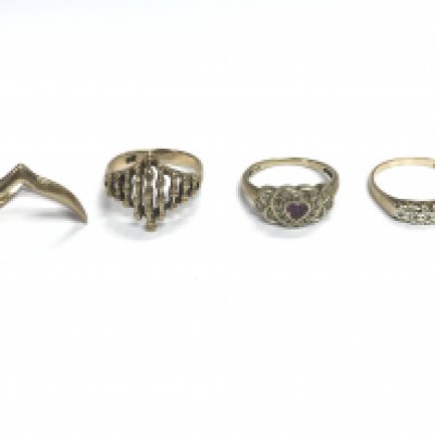 Four 9ct gold rings of various designs. 11.52g total