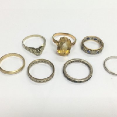 Two 9ct gold rings, a gold ring marked 333 and four others. Shipping category A.