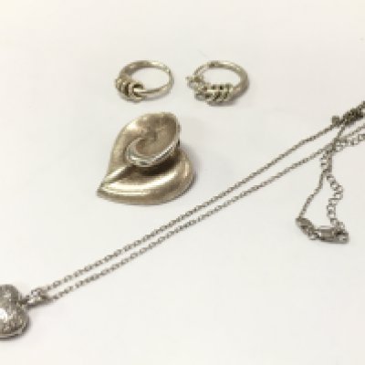 A silver group of jewellery including a silver floral pendant, earrings, heart pendant necklace. postage category A- NO RESERVE