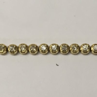 A 18ct yellow gold line bracelet inset with 51 diamonds.