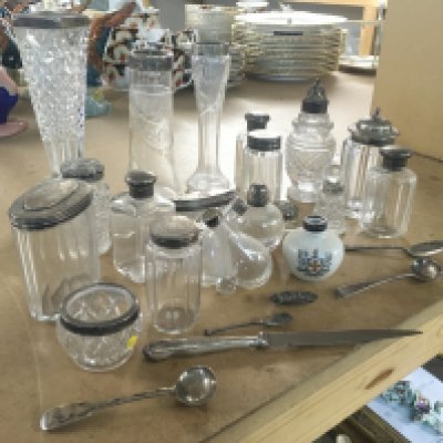 A collection of cut glass vases and containers with silver colllars and lids. Silver spoons and paper knife. This lot cannot be posted- NO RESERVE