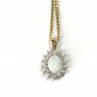A 9ct gold chain with a 9ct Opal and white stone pendant. 5.09g total. Postage A