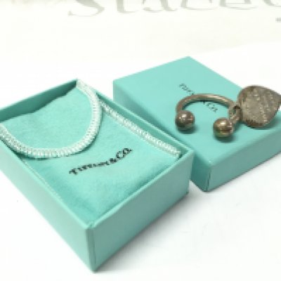 A boxed Tiffany key ring . Postage category A