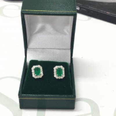 Pair of 18ct white gold step-cut emerald and RBC diamond cluster studs, boxed. Emeralds 1.43ct, Diamonds 0.73ct