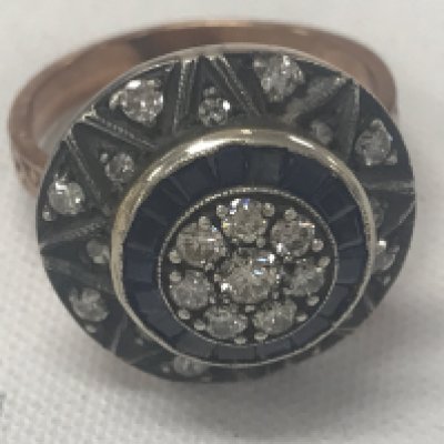 8ct rose gold target style ring set with RBC diamonds, calibre-cut sapphires and star-patterned diamond set surround. Diamonds 0.50ct. Sapphires 0.45ct