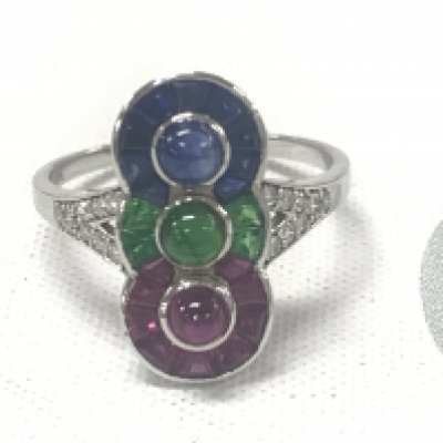 18ct yellow gold Art Deco-style ring set with a cabochon sapphire, ruby and emerald, together with calibre cut sapphires, rubies and emeralds and RBC diamonds. Sapphires 0.32 approx. Rubies 0.35ct approx. Emeralds 0.20ct approx. Diamonds 0.16ct approx.