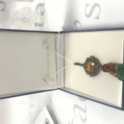 Large and exciting Jhumke-style pendant set with a large step-cut citrine, cabochon opals and diamonds, with beaded green onyx, crystal and malaya garnet in the tassle, on a silver chain. With a large box. Citrine 24.14ct. Opal 2.50ct. Diamonds 2.95ct.