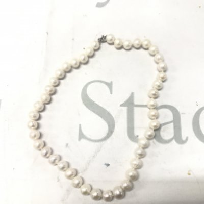 18" white cluttered pearl necklace with a silver lobster claw clasp.
