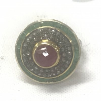 Large target style dress ring in silver and silver-gilt set with a round domed checkerboard pink tourmaline surrounded by rose cut diamonds, and an outer halo of square-cut emeralds. Tourmaline 1.88ct. Emeralds 1.29ct. Diamonds 0.63ct.