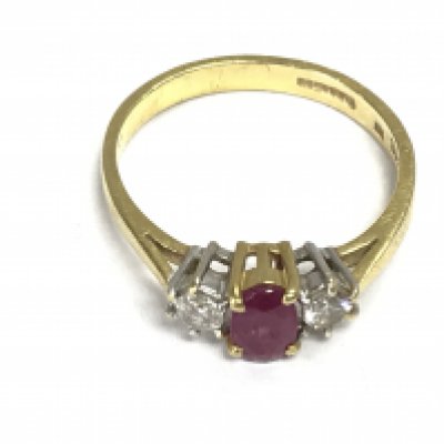 An 18ct gold ring set with Ruby and diamonds. Size O and 3.03g