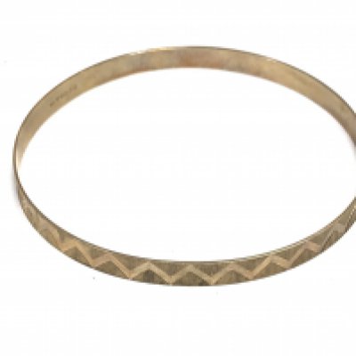 A 9ct gold bangle. Approximately 7cm diameter and 8.51g Postage A