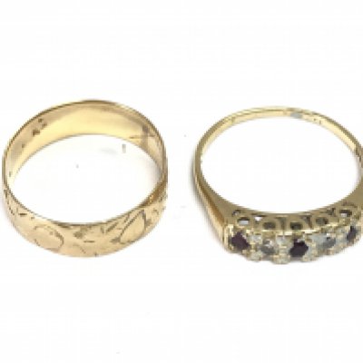 Two 18ct gold rings. Sizes R and T 7.15g Postage A