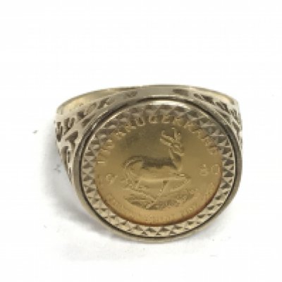 A 1980 1/10th Krugerrand coin in 9ct ring mount. 6.29g and size S