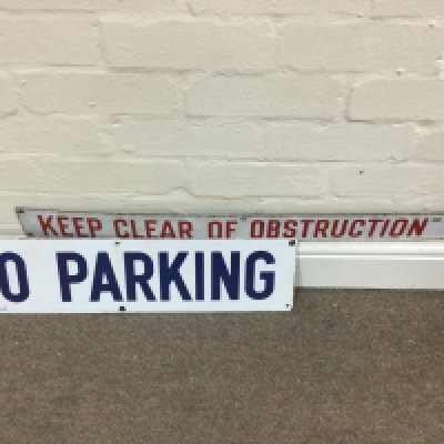 A no parking and a keep clear of obstruction signs. 6 x 25 inches approximately 3 x 30 inches approximately