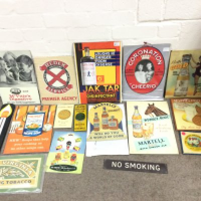 A collection of assorted advertising signs and cards.