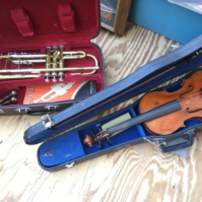 A cased trumpet and a cased student's violin (2).