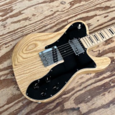 2011 Fender Telecaster "Telebration" Custom Model Solid Body Electric Guitar. Fender's 2010 era retake on the Classic Telecaster Custom of the 1970's. Natural finish with Fender Seth Lover Wide Range Pickups, Black 70's style fretboard markers in the varnished maple board and 1970's F stamped tuners. Overall good condition with some playwear, scratches on pick guard and tarnishing to frets, playwear on frets, otherwise fine. Comes in Fender indent marked Travel Sentry Case s/n US11301188