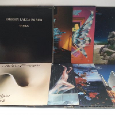 Two bags containing 16 prog rock LPs by various artists including Yes, Camel, ELP and others.